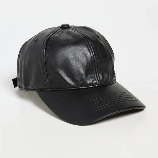 Black leather cap on a light gray background