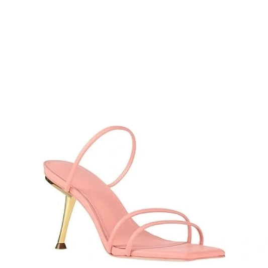 Pink high-heeled sandal with a gold heel on a white background.Discounted from Original price