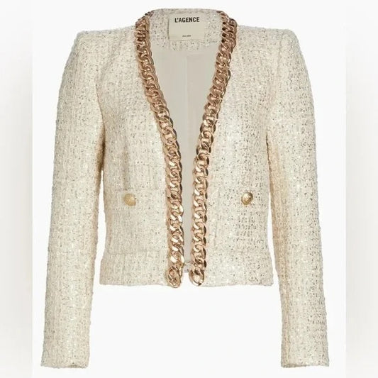 Beige blazer with gold chain details on a white background.Discounted from Original price
